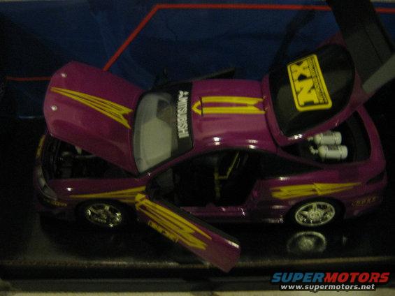 Purple toy car with yellow stripes, open hood and doors, and visible engine components