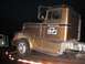 1959 Kenworth W900A - A brown truck with "Owyhee Sand & Gravel" text is seen on a flatbed trailer at night.