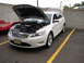 1992 Ford Taurus - White Ford Taurus SHO with hood and trunk open, parked in a lot.
