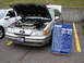 1992 Ford Taurus - A blue sign details the 1989 Ford Taurus SHO's specifications and ownership history.