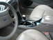 1992 Ford Taurus - Interior view of a car, leather seats, steering wheel, and center console. Text from a watermark is visible.
