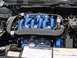 1992 Ford Taurus - Close-up of the engine bay, highlighting the SHO 24 VALVE DOHC engine components with vibrant blue intake runners.