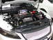 1992 Ford Taurus - The engine bay of a white Ford Taurus SHO, a "SHO ECOBOOST" engine cover and a toy police car.