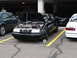1992 Ford Taurus - Black 1992 Ford Taurus is shown with its hood open at an event.