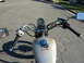1985 Honda CMX250 Rebel - View from the rider's seat shows the motorcycle's handlebars, instrument cluster, and fuel tank.