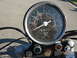 1985 Honda CMX250 Rebel - Close-up of a dusty motorcycle speedometer with a 599 mph reading and an odometer showing 19999 miles.