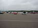 1992 Ford Taurus - Cars gathered at an outdoor event, with multiple vehicles visible on the asphalt lot.