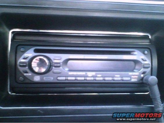 Car stereo with a large dial and several buttons