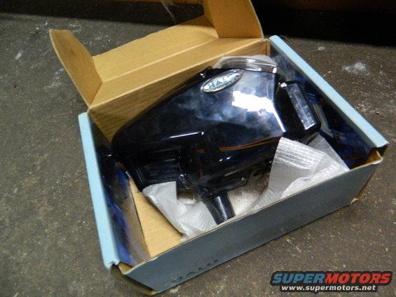 Black car part labeled HALO in a cardboard box