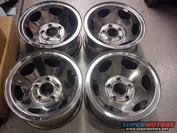four chrome wheels with five lug holes