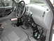 1984 Ford Bronco - This interior shot shows a vehicle equipped with adaptive driving controls, including modified pedals and steering assistance.