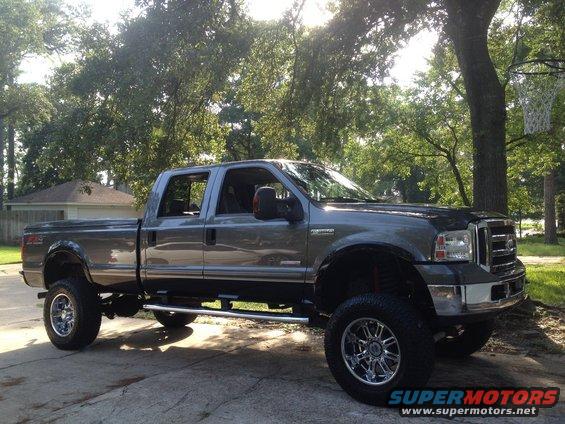 Gray lifted Ford F-350 pickup truck, 3q front view