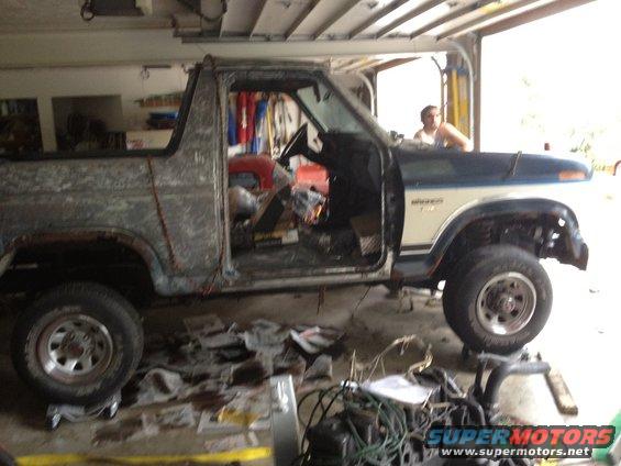 1986 Ford Bronco side view, doors removed, in garage
