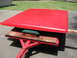 2001 Ford F-150 - A red truck cap is shown resting on a wooden platform atop a trailer.
