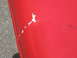 2001 Ford F-150 - Close-up of a damaged red surface with a watermark at the bottom right.
