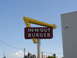 1992 Ford Taurus - Iconic In-N-Out Burger sign with its distinctive arrow and red message board.