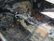 1978 Nissan 300ZX - The interior of a car is in disrepair, with exposed metal, rust, and missing components.