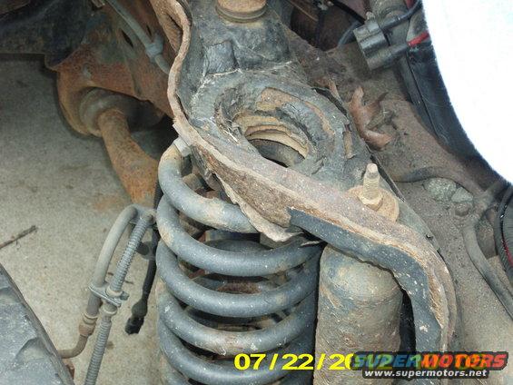 The right spring here has already shifted about a 1/2 inch outwards (towards the wheel), as there is nothing left to the base of this shock tower.