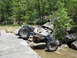 1967 Ford Mustang - A custom-built off-road buggy tackles a challenging rocky stream crossing.