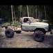 1983 Chevrolet C/K Pickup - This modified 1983 Chevrolet C/K Pickup features oversized tires and a removed bed, giving it a unique off-road stance.