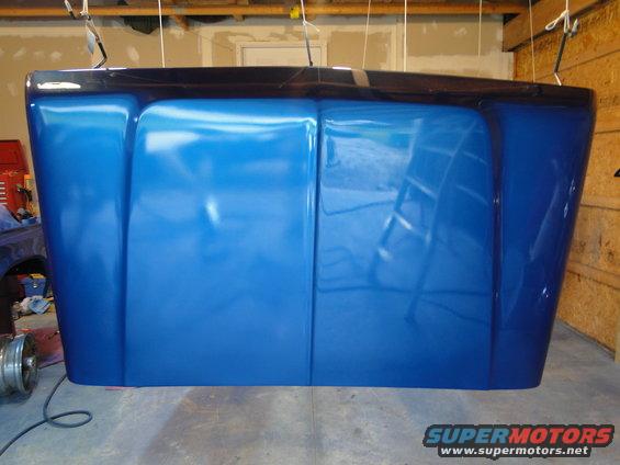 blue hood hanging in garage