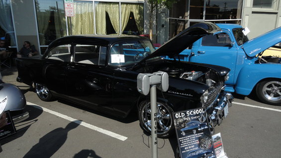 Black 1955 Chevrolet sedan, 3q-front view, hood open