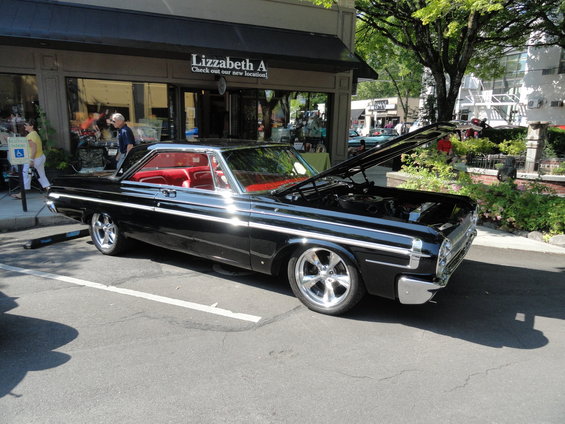 1964 Ford Fairlane coupe, black exterior, red interior, hood open showing engine