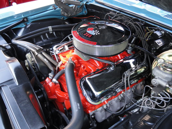Engine bay with a red V8 engine, chrome valve covers, and a chrome air cleaner with '396 Turbo-Jet 350 HP' text