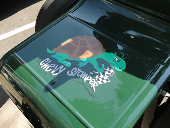 Green car hood with a cartoon turtle graphic and "Chevy Stomper" text