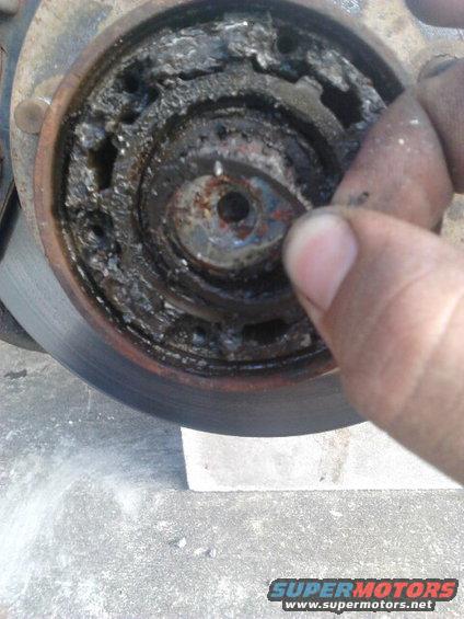 Take off the small C-clip that is around the axleshaft