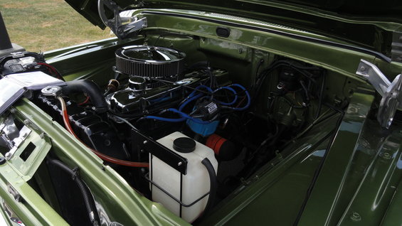 green engine bay with chrome air cleaner and blue spark plug wires