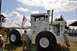 1959 Kenworth W900A - A large white tractor with the designation HN 250 is displayed outdoors with an American flag.