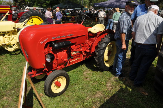 Red Porsche Diesel Junior tractor with yellow seat and wheels, 1958 model year visible