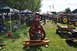 1959 Kenworth W900A - A collection of vintage farm equipment and engines displayed outdoors under tents.