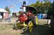 1959 Kenworth W900A - A vintage steam tractor is displayed at an outdoor event, with portable restrooms in the background.