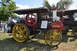 1959 Kenworth W900A - A Russell steam tractor from 1911 is displayed outdoors with another engine in the background.
