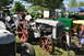 1959 Kenworth W900A - A collection of tractors are displayed at an outdoor event, with one prominent gray tractor in the foreground.