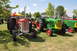 1959 Kenworth W900A - Vintage tractors gathered for display at an outdoor event, various makes and models.