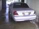 2003 Ford Crown Victoria - Rear view of a 2003 Ford Crown Victoria parked inside a car wash bay.
