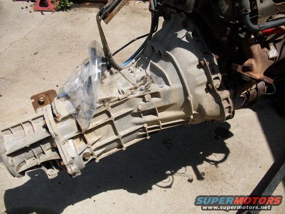 Transmission assembly with protective plastic covering