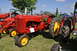 1959 Kenworth W900A - A Massey-Harris 30 tractor is displayed outdoors at an event with other farm equipment.
