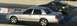2003 Ford Crown Victoria - A silver 2003 Ford Crown Victoria competes in a drag race alongside another vehicle.