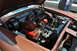 1959 Kenworth W900A - The engine bay of a brown car, a V8 engine with dual air cleaners and a prominent radiator.