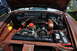 1959 Kenworth W900A - The engine bay of a vintage car is shown with its V8 engine and various components.