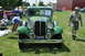 1959 Kenworth W900A - A green vintage car, identified by its license plate and "Oregon 1932" inscription, is displayed at an outdoor event.