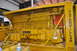 1959 Kenworth W900A - The side of a large yellow Caterpillar engine is shown, with various pipes and components.