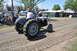 1959 Kenworth W900A - Tractor participating in an event, with spectators in the background.