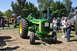 1959 Kenworth W900A - Green John Deere tractor with yellow accents and large rear tires is displayed at an outdoor event.