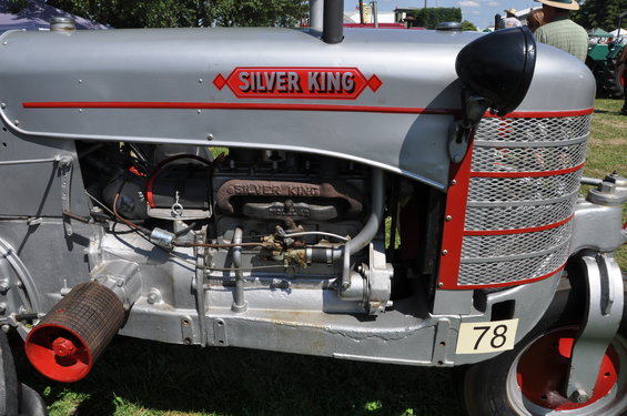 Silver tractor with red trim and "SILVER KING" badging, front view