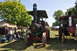 1959 Kenworth W900A - A vintage steam tractor, identified by its badge as an International Harvester from 1909, is displayed at an outdoor event.